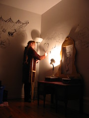 girl on crutch drawing on wall